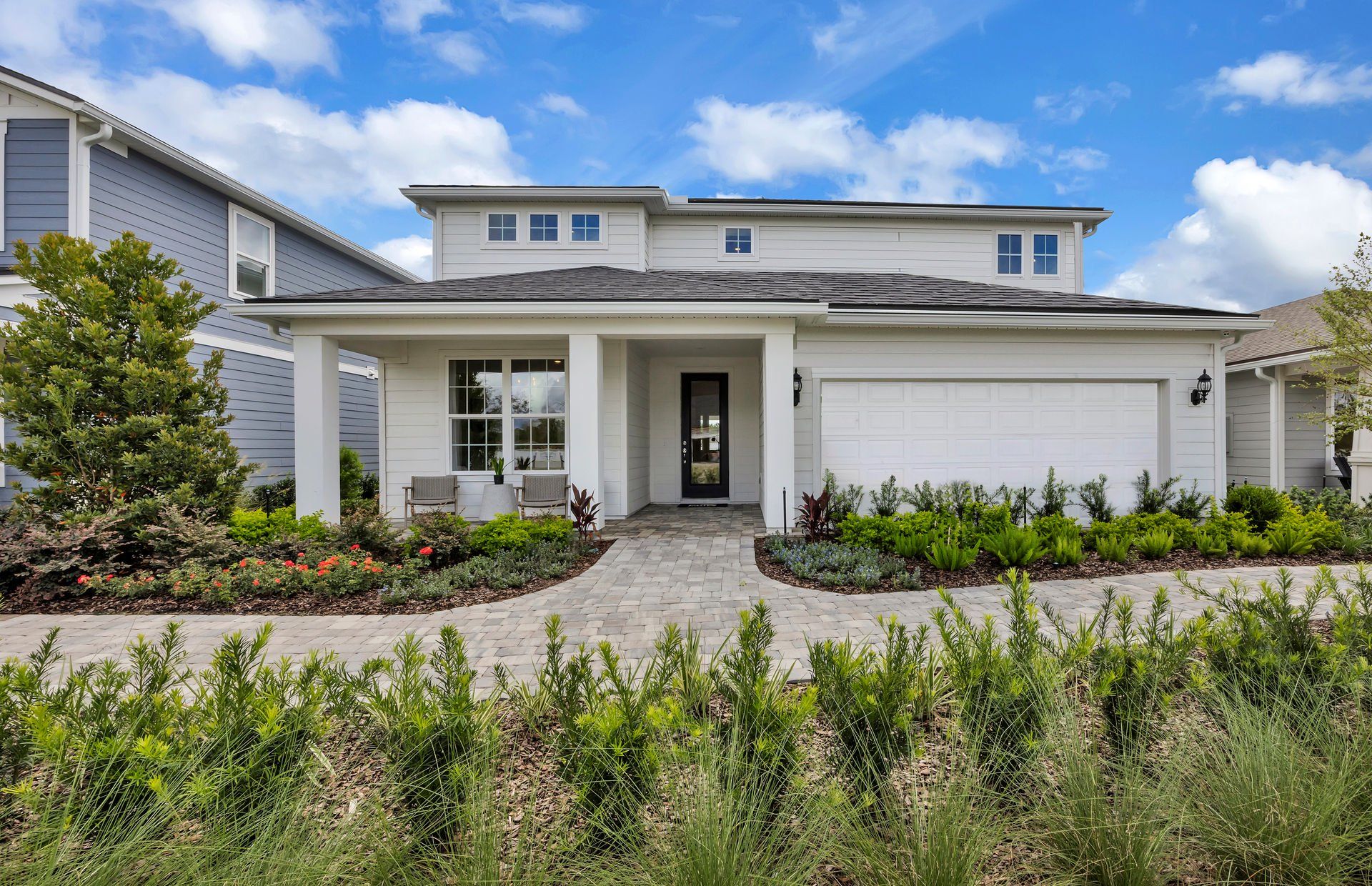 Front exterior of a new home in Double Branch, Middleburg, FL, highlighting curb appeal (Image 1). Front exterior of a new home in Double Branch, Middleburg, FL, highlighting curb appeal (Image 1).