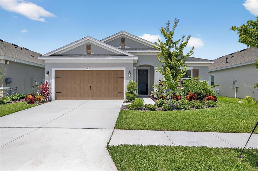 Front exterior of a new home in Waterset, Apollo Beach, FL, highlighting curb appeal (Image 1). Front exterior of a new home in Waterset, Apollo Beach, FL, highlighting curb appeal (Image 1).