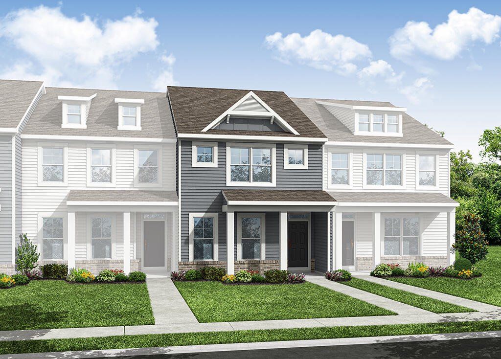 Front exterior of a new home in Enclave at Traditions Townhomes, Wake Forest, NC, highlighting curb appeal (Image 1). Front exterior of a new home in Enclave at Traditions Townhomes, Wake Forest, NC, highlighting curb appeal (Image 1).
