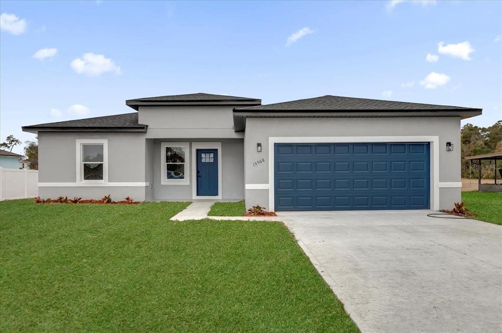 Front exterior of a new home in , Ocala, FL, highlighting curb appeal (Image 1). Front exterior of a new home in , Ocala, FL, highlighting curb appeal (Image 1).