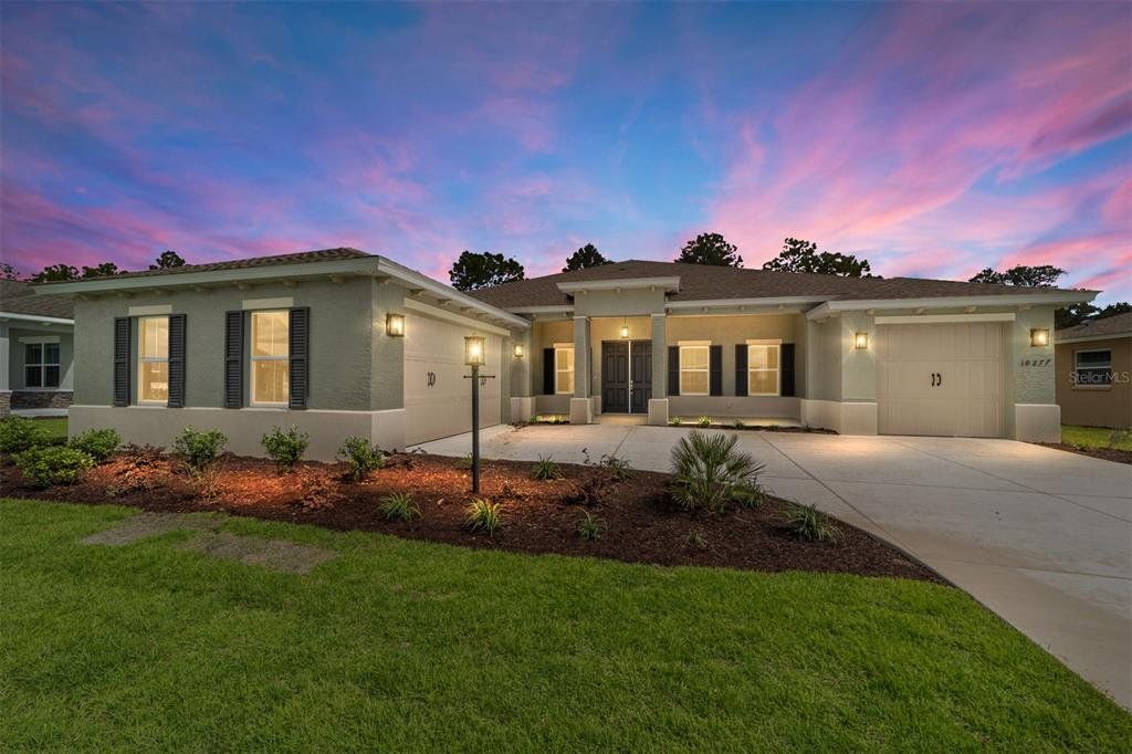 Front exterior of a new home in On Top of the World Communities, Ocala, FL, highlighting curb appeal (Image 1). Front exterior of a new home in On Top of the World Communities, Ocala, FL, highlighting curb appeal (Image 1).
