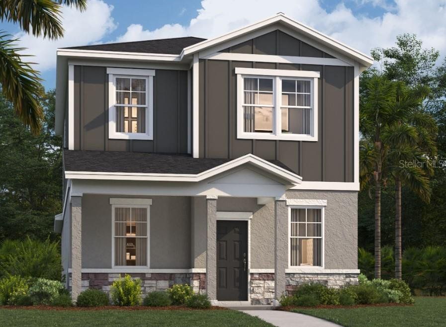 Front exterior of a new home in Spring Walk at the Junction, Debary, FL, highlighting curb appeal (Image 1).
