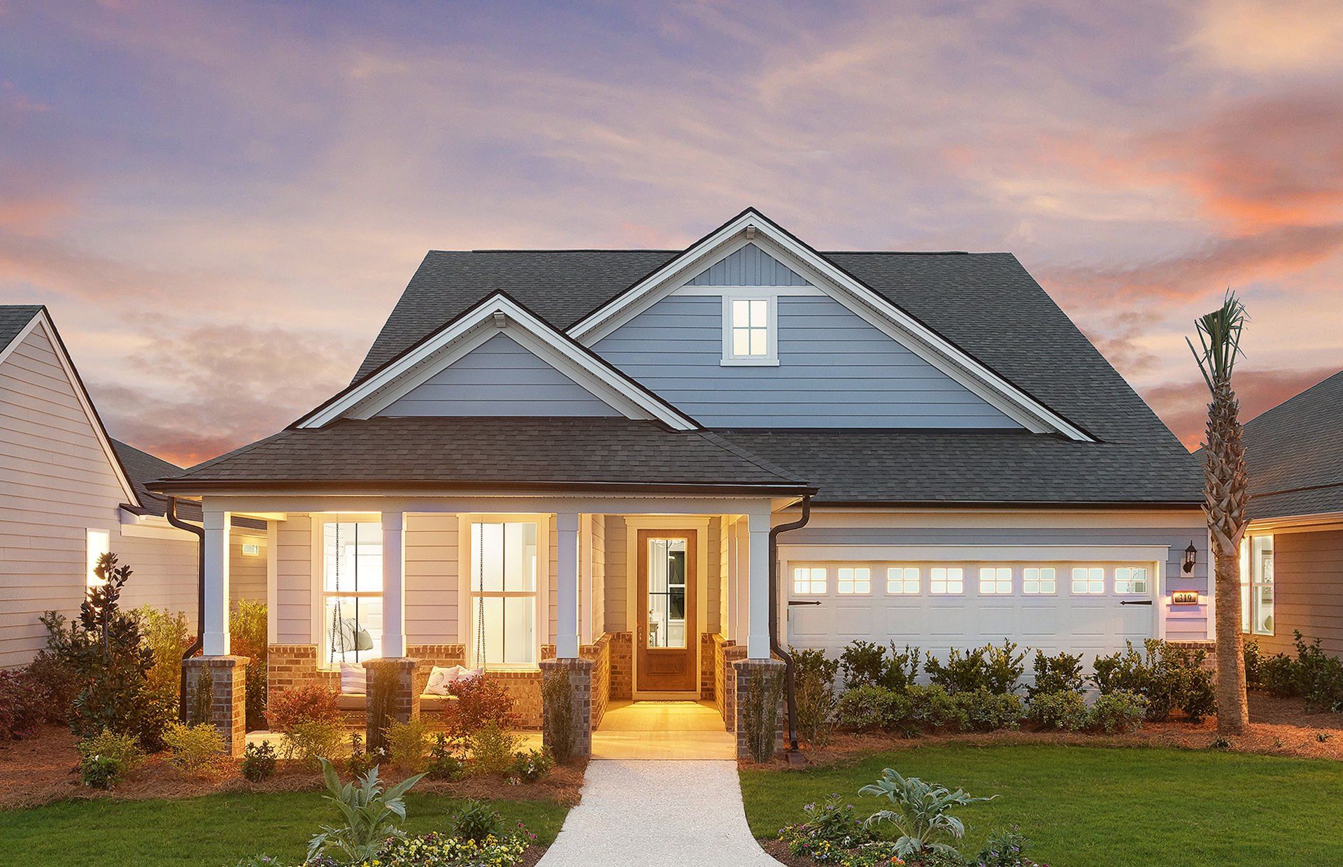 Front exterior of a new home in Heartwood, Richmond Hill, GA, highlighting curb appeal (Image 1).