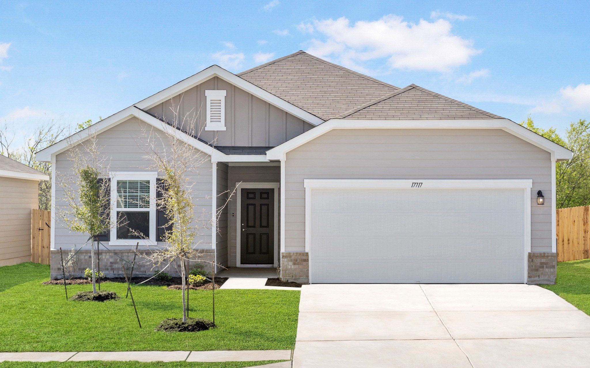 Front exterior of a new home in Royal Pines, Porter, TX, highlighting curb appeal (Image 1). Front exterior of a new home in Royal Pines, Porter, TX, highlighting curb appeal (Image 1).