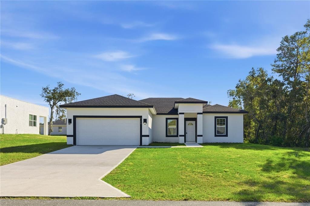 Front exterior of a new home in , Ocala, FL, highlighting curb appeal (Image 1). Front exterior of a new home in , Ocala, FL, highlighting curb appeal (Image 1).