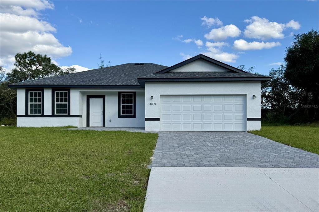 Front exterior of a new home in , Ocala, FL, highlighting curb appeal (Image 1). Front exterior of a new home in , Ocala, FL, highlighting curb appeal (Image 1).