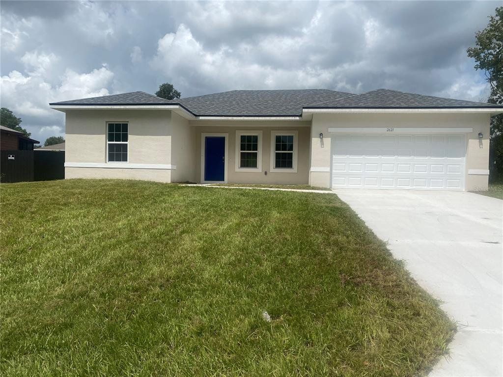 Front exterior of a new home in , Ocala, FL, highlighting curb appeal (Image 1).