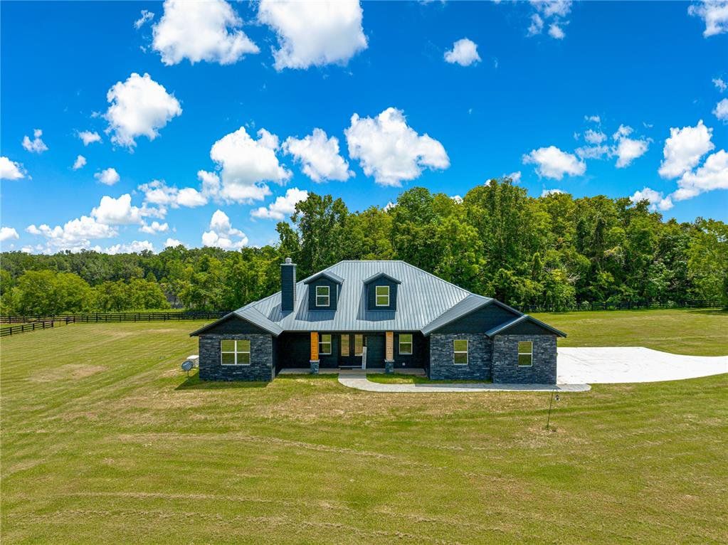 Front exterior of a new home in , Ocala, FL, highlighting curb appeal (Image 1). Front exterior of a new home in , Ocala, FL, highlighting curb appeal (Image 1).