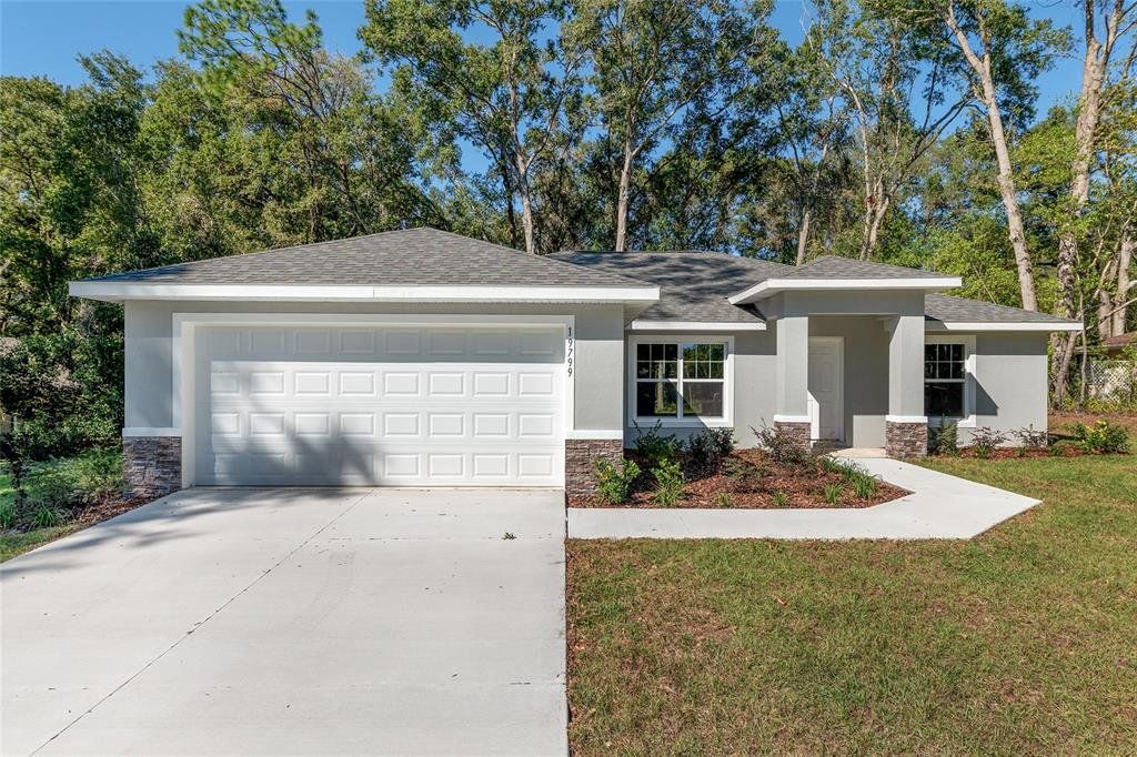 Front exterior of a new home in , Dunnellon, FL, highlighting curb appeal (Image 1). Front exterior of a new home in , Dunnellon, FL, highlighting curb appeal (Image 1).