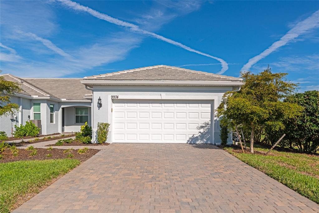 Front exterior of a new home in , Englewood, FL, highlighting curb appeal (Image 1). Front exterior of a new home in , Englewood, FL, highlighting curb appeal (Image 1).