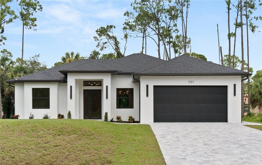 Front exterior of a new home in , North Port, FL, highlighting curb appeal (Image 1).