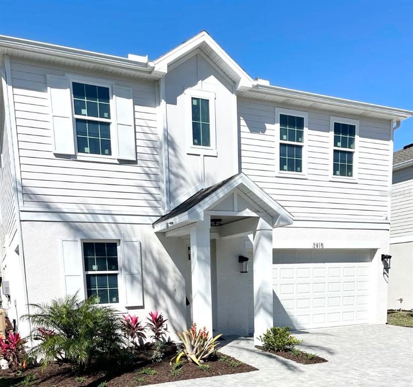 Front exterior of a new home in , Tampa, FL, highlighting curb appeal (Image 1). Front exterior of a new home in , Tampa, FL, highlighting curb appeal (Image 1).