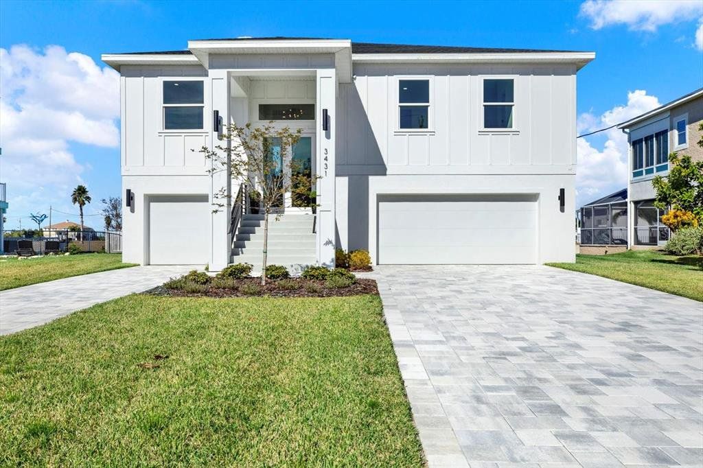 Front exterior of a new home in , Hernando Beach, FL, highlighting curb appeal (Image 1). Front exterior of a new home in , Hernando Beach, FL, highlighting curb appeal (Image 1).