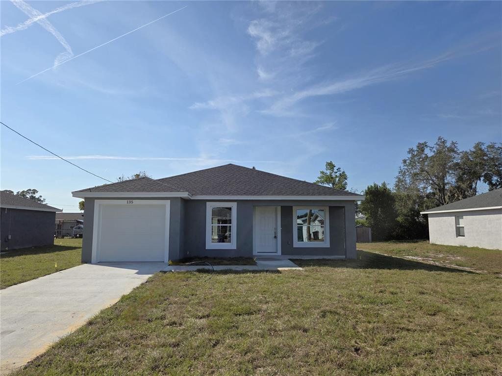 Front exterior of a new home in , Lake Wales, FL, highlighting curb appeal (Image 1). Front exterior of a new home in , Lake Wales, FL, highlighting curb appeal (Image 1).