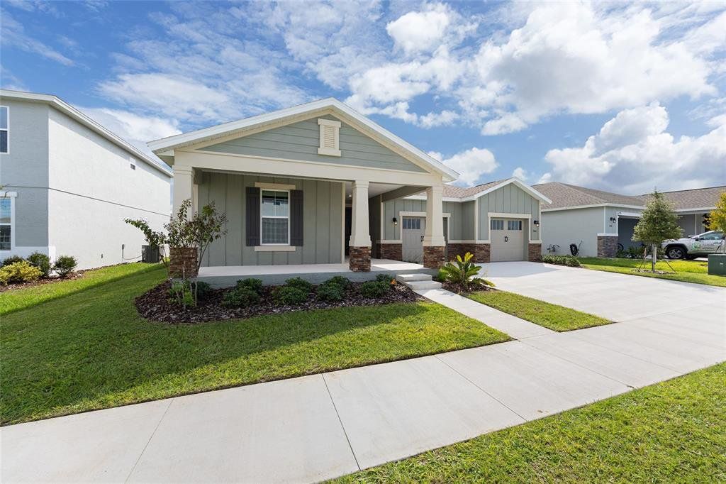 Front exterior of a new home in Calesa Township, Ocala, FL, highlighting curb appeal (Image 1). Front exterior of a new home in Calesa Township, Ocala, FL, highlighting curb appeal (Image 1).