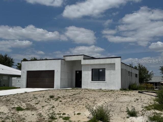 Front exterior of a new home in , Cape Coral, FL, highlighting curb appeal (Image 1). Front exterior of a new home in , Cape Coral, FL, highlighting curb appeal (Image 1).