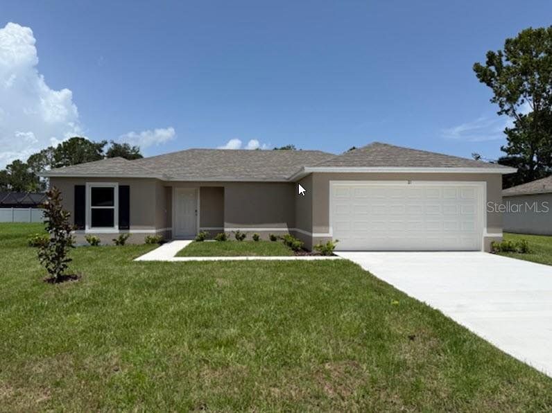 Front exterior of a new home in Palm Coast, Palm Coast, FL, highlighting curb appeal (Image 1). Front exterior of a new home in Palm Coast, Palm Coast, FL, highlighting curb appeal (Image 1).