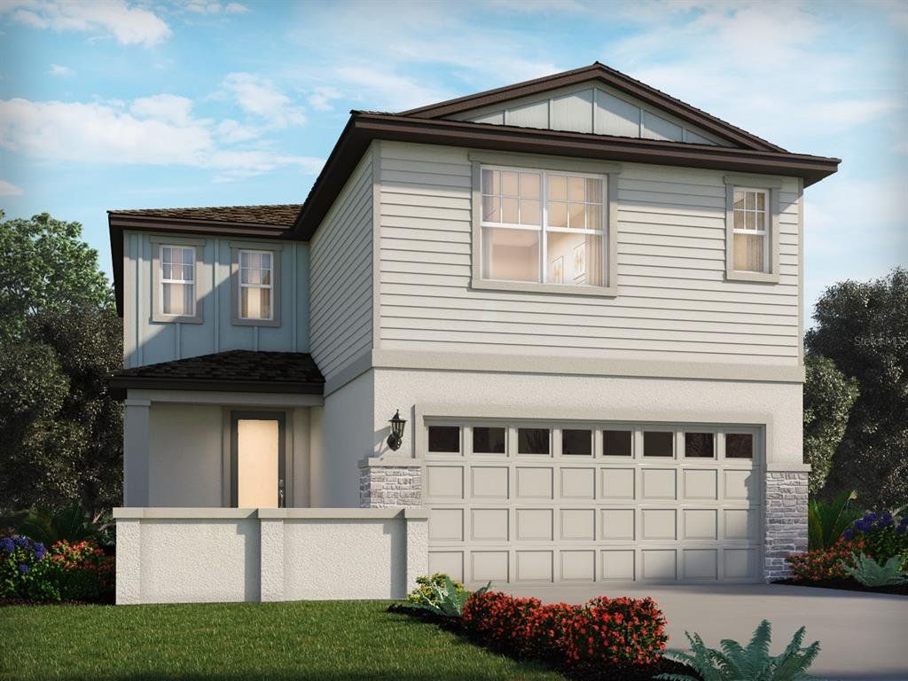 Front exterior of a new home in Springs at Lake Alfred - Classic Series, Lake Alfred, FL, highlighting curb appeal (Image 1). Front exterior of a new home in Springs at Lake Alfred - Classic Series, Lake Alfred, FL, highlighting curb appeal (Image 1).