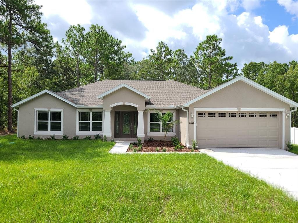 Front exterior of a new home in , Weeki Wachee, FL, highlighting curb appeal (Image 1). Front exterior of a new home in , Weeki Wachee, FL, highlighting curb appeal (Image 1).