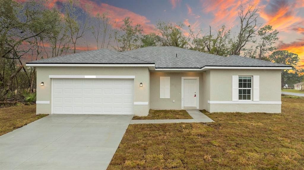 Front exterior of a new home in , Dunnellon, FL, highlighting curb appeal (Image 1). Front exterior of a new home in , Dunnellon, FL, highlighting curb appeal (Image 1).