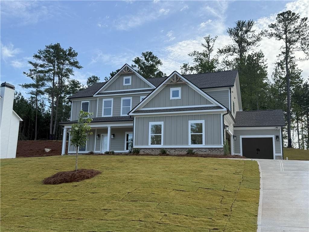 Front exterior of a new home in Woodland Hills, Loganville, GA, highlighting curb appeal (Image 1). Front exterior of a new home in Woodland Hills, Loganville, GA, highlighting curb appeal (Image 1).