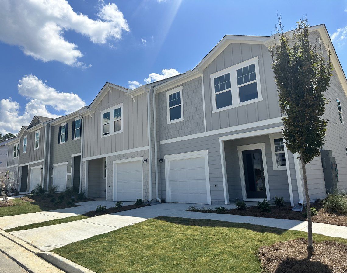 Front exterior of a new home in Chestnut Grove, Douglasville, GA, highlighting curb appeal (Image 1). Front exterior of a new home in Chestnut Grove, Douglasville, GA, highlighting curb appeal (Image 1).