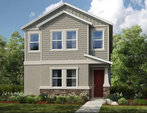 Front exterior of a new home in Harvest at Ovation, Winter Garden, FL, highlighting curb appeal (Image 1). Front exterior of a new home in Harvest at Ovation, Winter Garden, FL, highlighting curb appeal (Image 1).