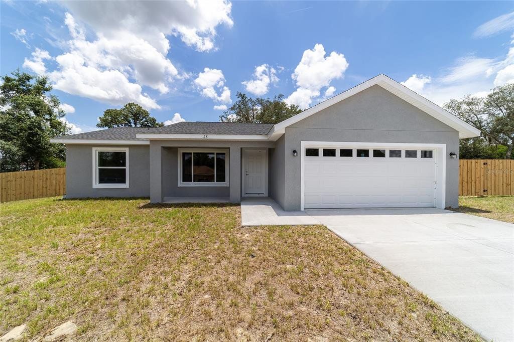 Front exterior of a new home in , Ocklawaha, FL, highlighting curb appeal (Image 1). Front exterior of a new home in , Ocklawaha, FL, highlighting curb appeal (Image 1).