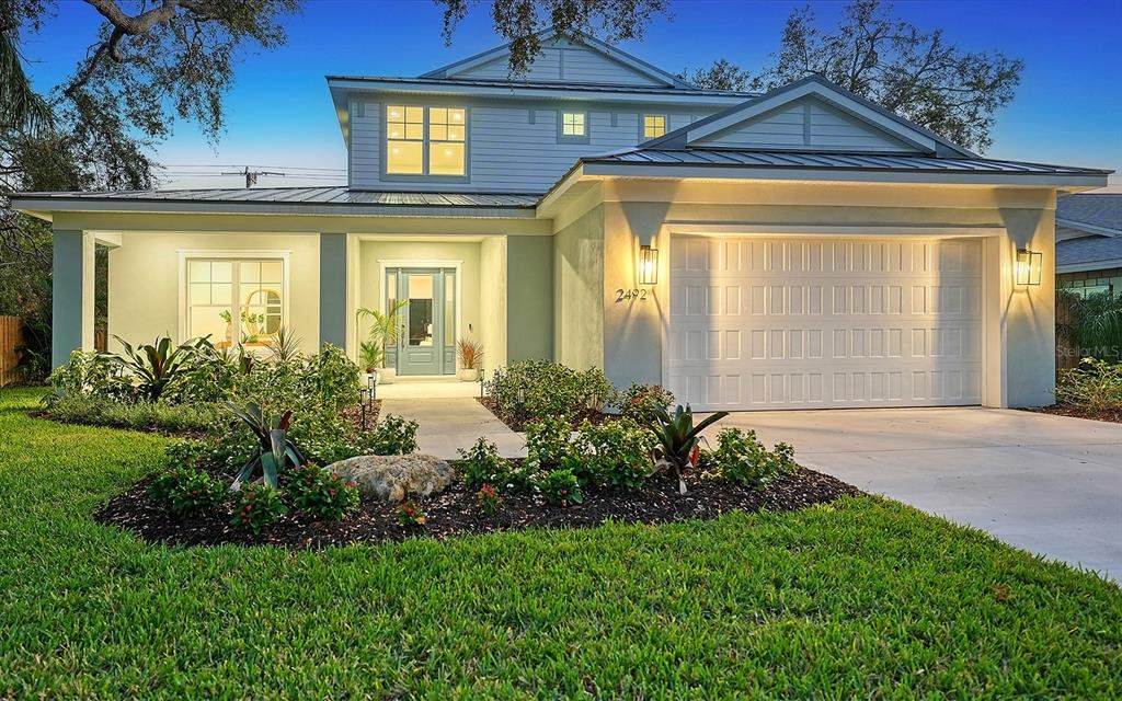 Front exterior of a new home in , Sarasota, FL, highlighting curb appeal (Image 1). Front exterior of a new home in , Sarasota, FL, highlighting curb appeal (Image 1).
