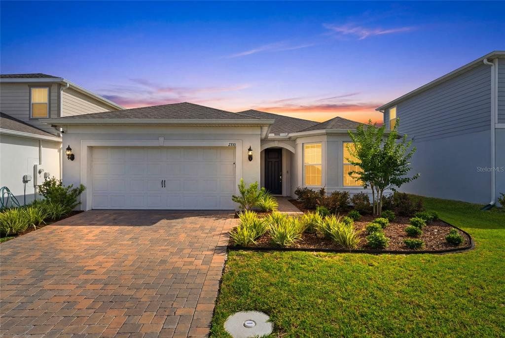 Front exterior of a new home in , Kissimmee, FL, highlighting curb appeal (Image 1). Front exterior of a new home in , Kissimmee, FL, highlighting curb appeal (Image 1).