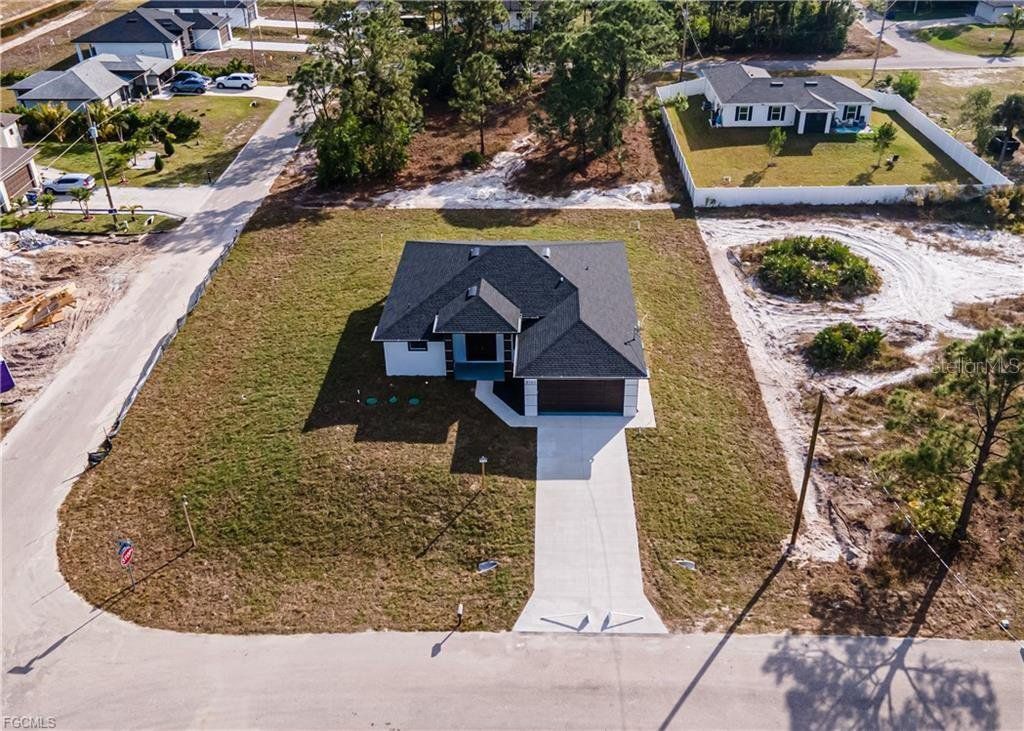 Front exterior of a new home in , Lehigh Acres, FL, highlighting curb appeal (Image 1). Front exterior of a new home in , Lehigh Acres, FL, highlighting curb appeal (Image 1).