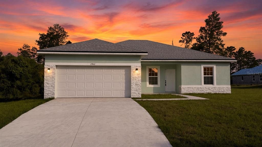 Front exterior of a new home in , Ocala, FL, highlighting curb appeal (Image 1). Front exterior of a new home in , Ocala, FL, highlighting curb appeal (Image 1).