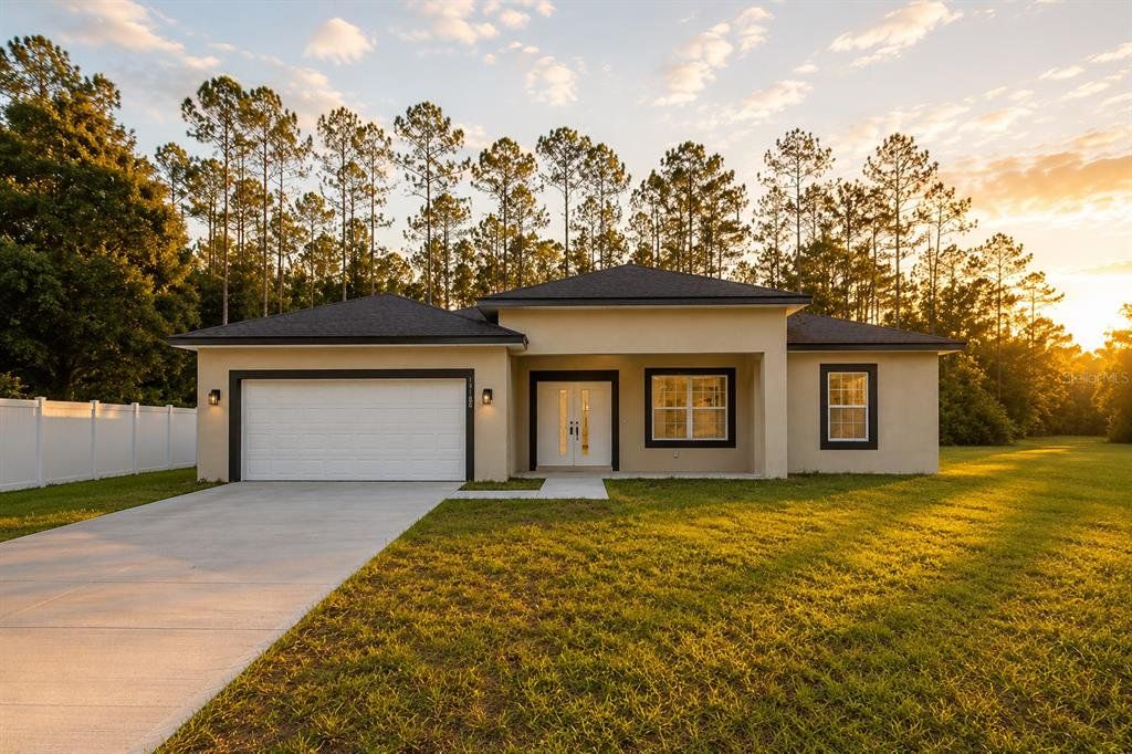 Front exterior of a new home in , Citrus Springs, FL, highlighting curb appeal (Image 1). Front exterior of a new home in , Citrus Springs, FL, highlighting curb appeal (Image 1).