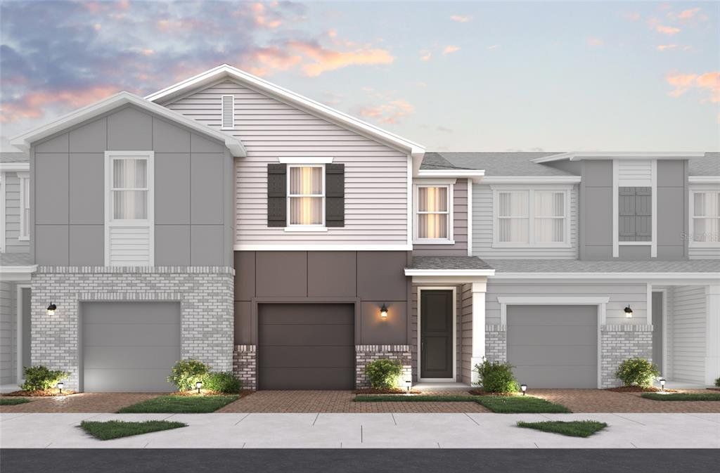 Front exterior of a new home in Towns at Riverwalk, Sanford, FL, highlighting curb appeal (Image 1). Front exterior of a new home in Towns at Riverwalk, Sanford, FL, highlighting curb appeal (Image 1).