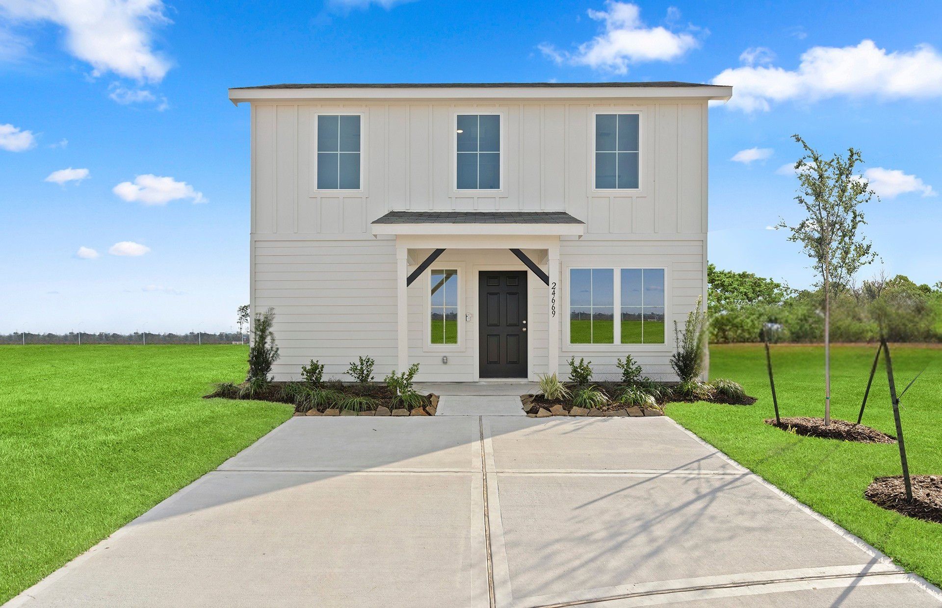 Front exterior of a new home in The Courtyards at Stokesbury, Waller, TX, highlighting curb appeal (Image 1).