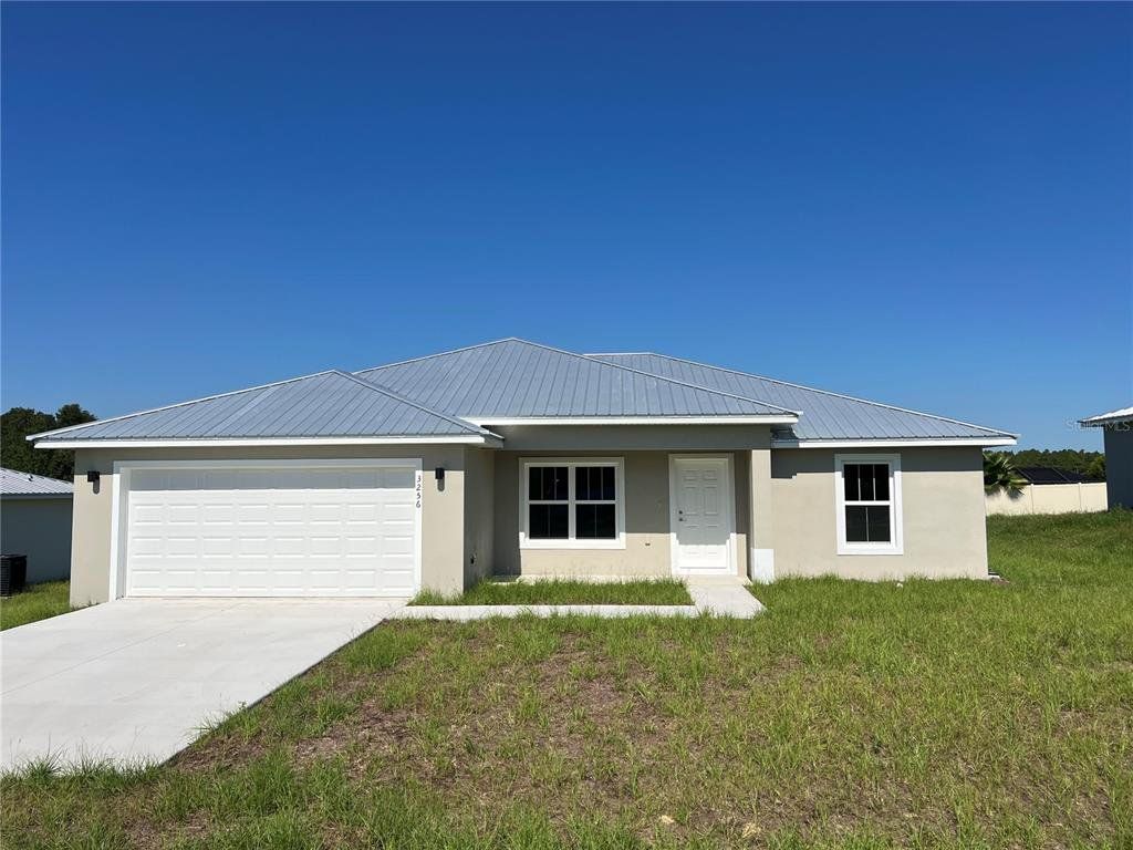 Front exterior of a new home in , Sebring, FL, highlighting curb appeal (Image 1). Front exterior of a new home in , Sebring, FL, highlighting curb appeal (Image 1).