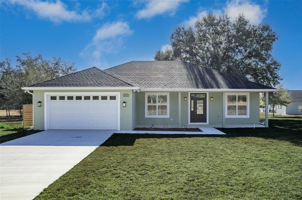 Front exterior of a new home in , Citrus Springs, FL, highlighting curb appeal (Image 1). Front exterior of a new home in , Citrus Springs, FL, highlighting curb appeal (Image 1).