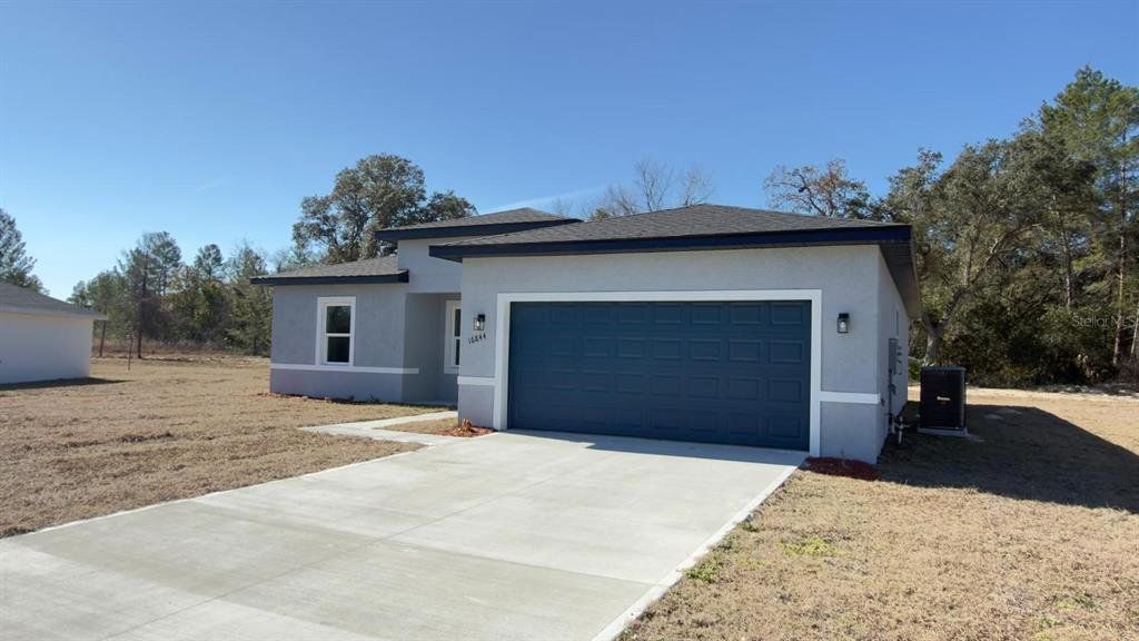 Front exterior of a new home in , Ocala, FL, highlighting curb appeal (Image 1). Front exterior of a new home in , Ocala, FL, highlighting curb appeal (Image 1).