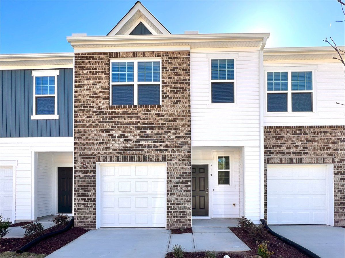 Front exterior of a new home in Glenn Crossing, Durham, NC, highlighting curb appeal (Image 1). Front exterior of a new home in Glenn Crossing, Durham, NC, highlighting curb appeal (Image 1).