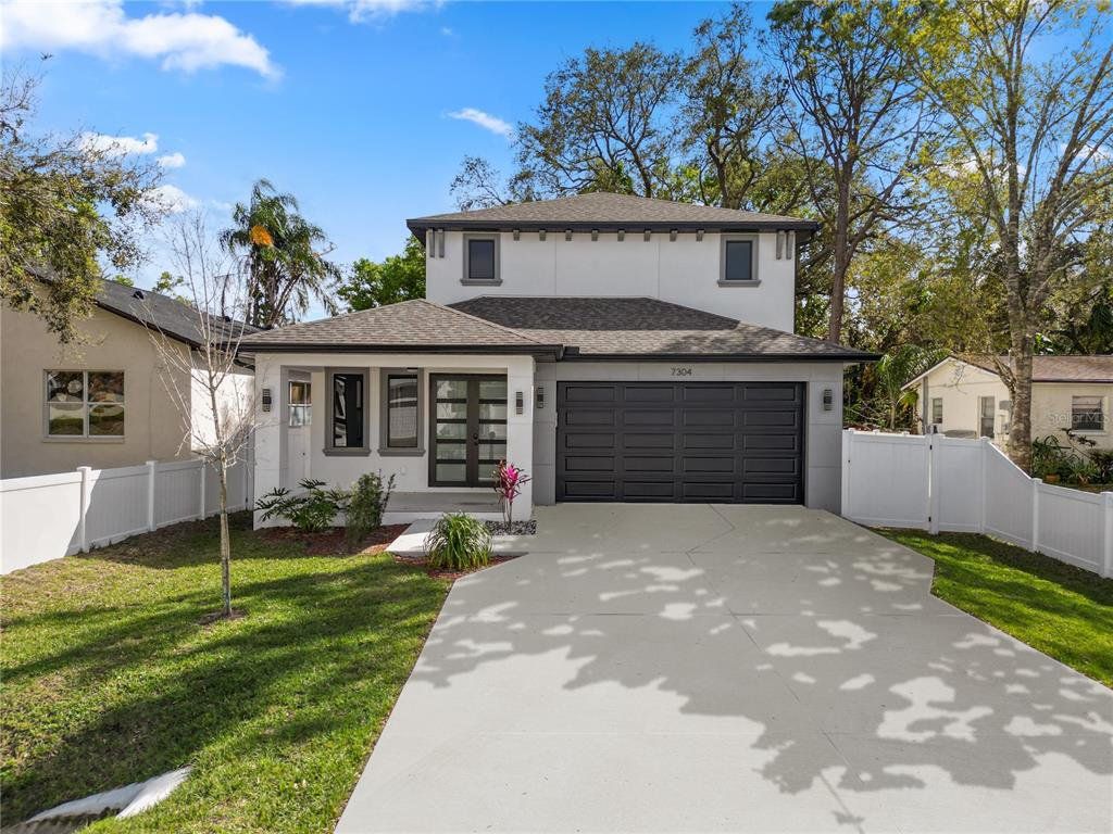 Front exterior of a new home in , Tampa, FL, highlighting curb appeal (Image 1). Front exterior of a new home in , Tampa, FL, highlighting curb appeal (Image 1).