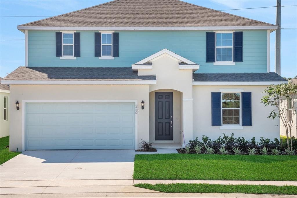 Front exterior of a new home in Willowbrook North, Winter Haven, FL, highlighting curb appeal (Image 1). Front exterior of a new home in Willowbrook North, Winter Haven, FL, highlighting curb appeal (Image 1).