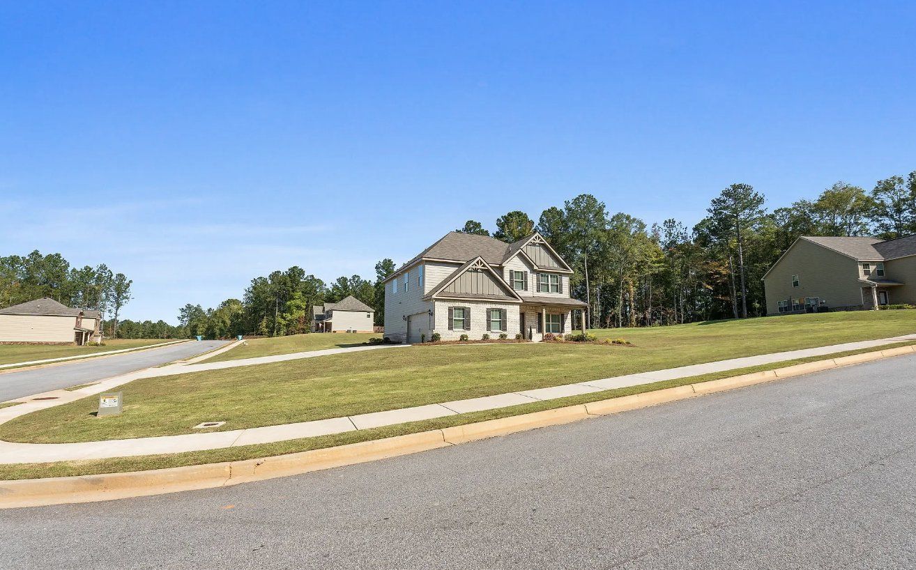 Front exterior of a home in the Shadow Creek community, located in Jackson, GA (Image 1). Front exterior of a home in the Shadow Creek community, located in Jackson, GA (Image 1).