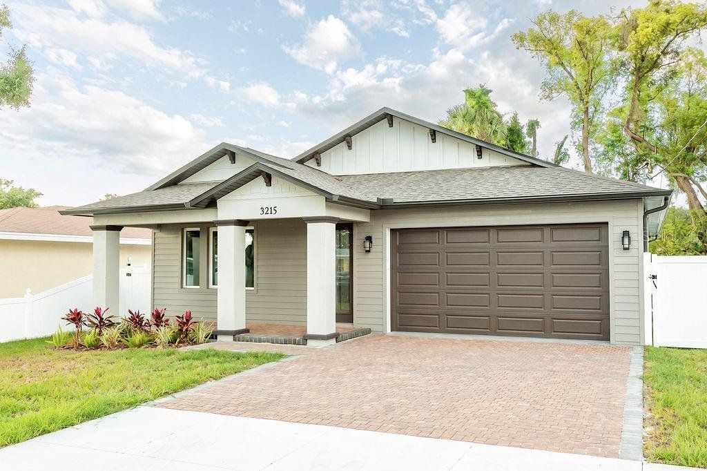 Front exterior of a new home in , Tampa, FL, highlighting curb appeal (Image 1). Front exterior of a new home in , Tampa, FL, highlighting curb appeal (Image 1).