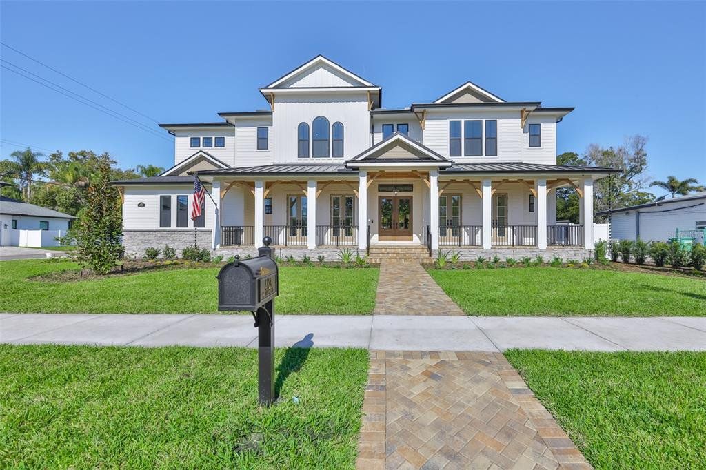 Front exterior of a new home in , Tampa, FL, highlighting curb appeal (Image 1). Front exterior of a new home in , Tampa, FL, highlighting curb appeal (Image 1).