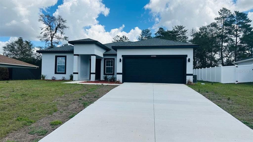 Front exterior of a new home in , Ocala, FL, highlighting curb appeal (Image 1). Front exterior of a new home in , Ocala, FL, highlighting curb appeal (Image 1).