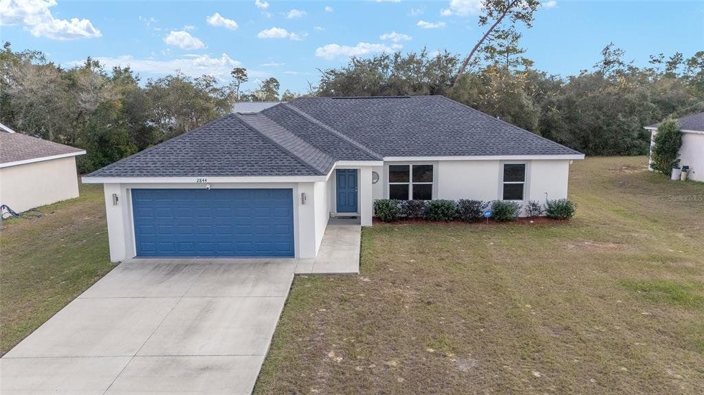 Front exterior of a new home in , Ocala, FL, highlighting curb appeal (Image 1). Front exterior of a new home in , Ocala, FL, highlighting curb appeal (Image 1).