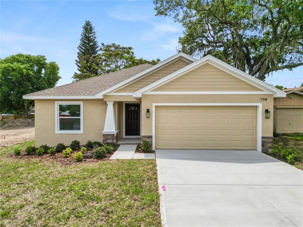 Front exterior of a new home in , Eagle Lake, FL, highlighting curb appeal (Image 1). Front exterior of a new home in , Eagle Lake, FL, highlighting curb appeal (Image 1).