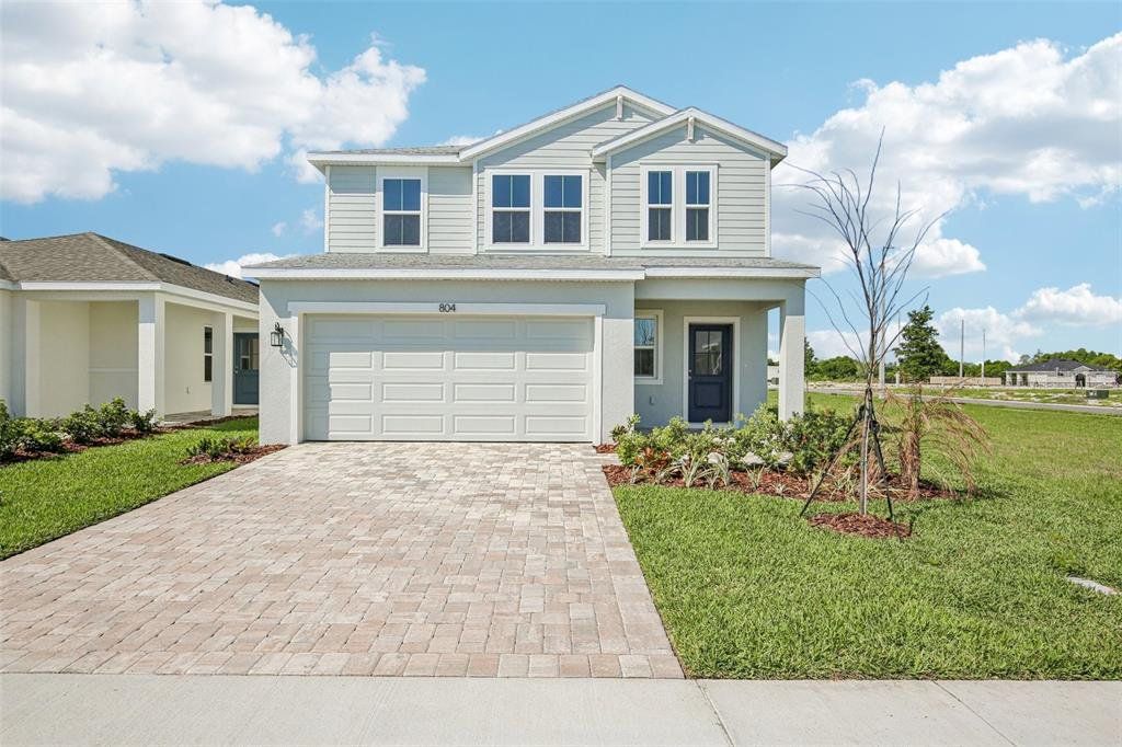 Front exterior of a new home in Willowbrook North, Winter Haven, FL, highlighting curb appeal (Image 1). Front exterior of a new home in Willowbrook North, Winter Haven, FL, highlighting curb appeal (Image 1).