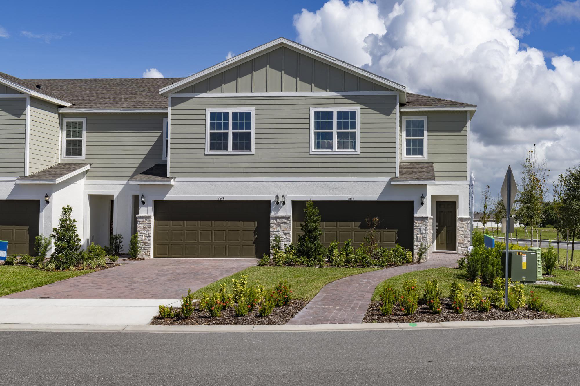 Front exterior of a new home in Sky Lakes Estates, St. Cloud, FL, highlighting curb appeal (Image 1). Front exterior of a new home in Sky Lakes Estates, St. Cloud, FL, highlighting curb appeal (Image 1).
