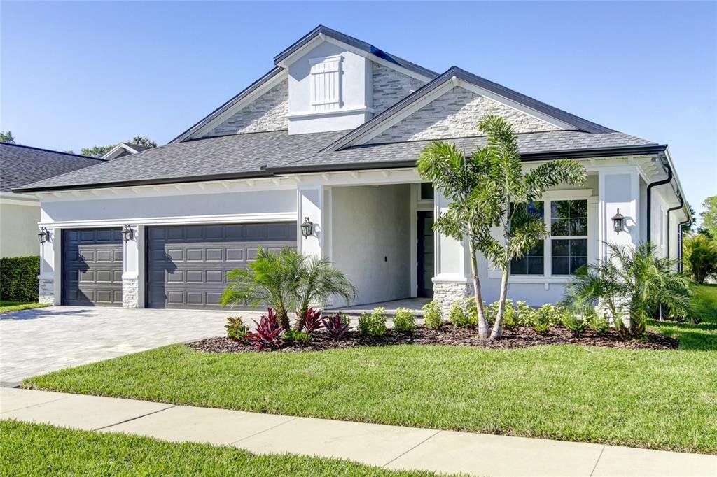 Front exterior of a new home in , Safety Harbor, FL, highlighting curb appeal (Image 1).
